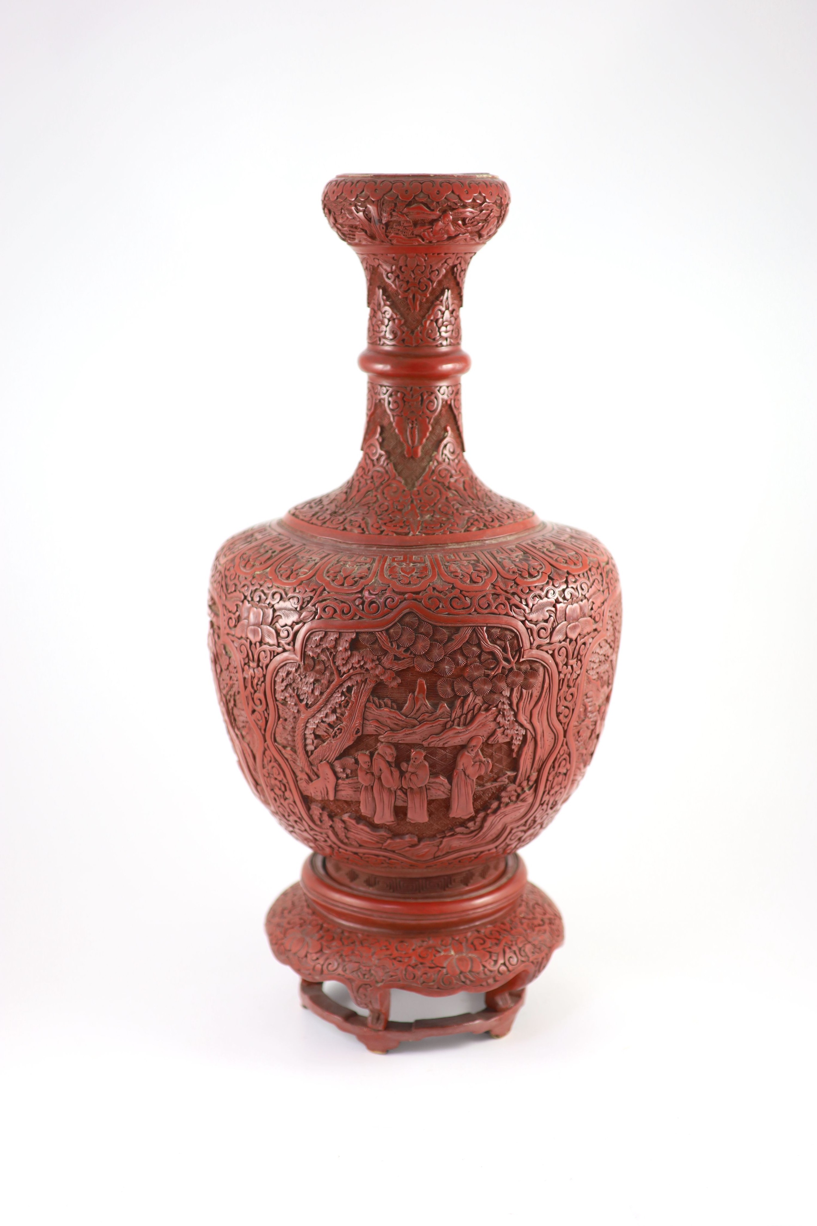 A large Chinese cinnabar lacquer garlic-neck vase and stand, c.1900, Total height 60.5 cm, base of vase drilled